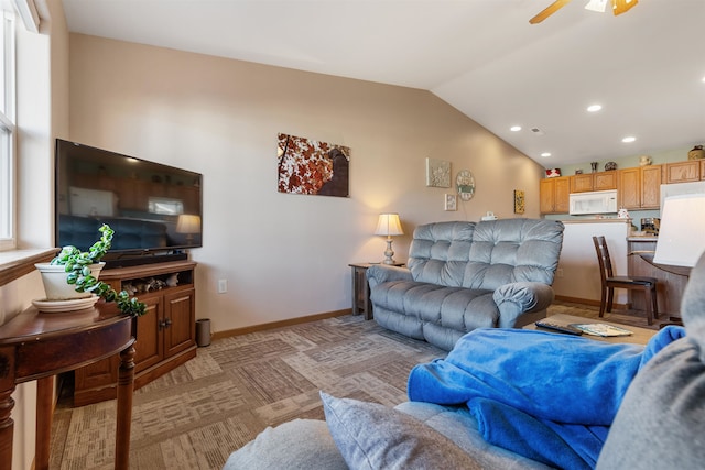 living room featuring light carpet, ceiling fan, and lofted ceiling