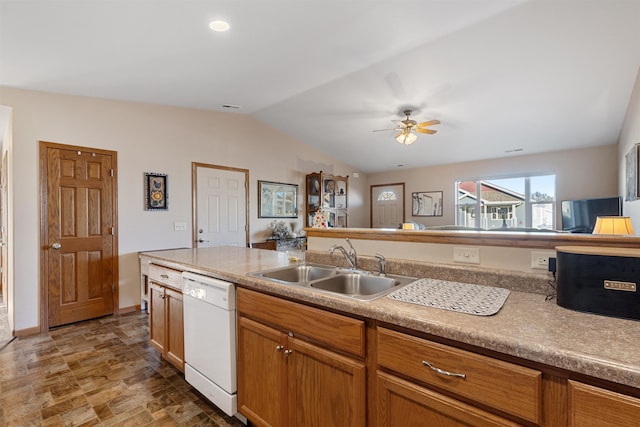 kitchen featuring dishwasher, vaulted ceiling, ceiling fan, and sink