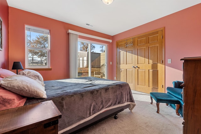 bedroom featuring carpet and access to outside