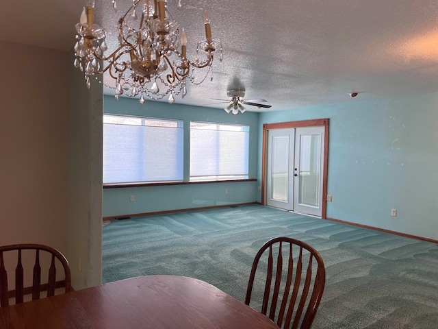 unfurnished dining area featuring carpet, french doors, a textured ceiling, and ceiling fan