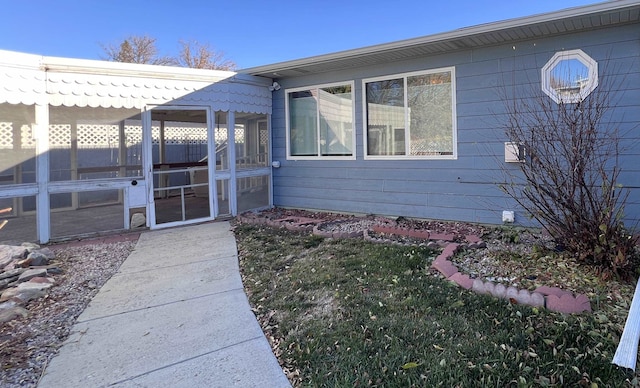 exterior space featuring a sunroom