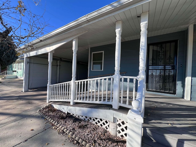 view of exterior entry featuring a porch