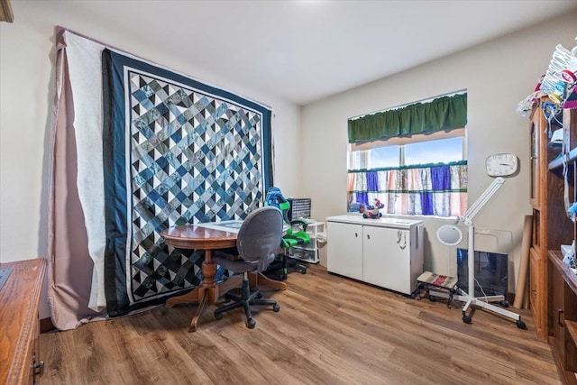 office with light hardwood / wood-style flooring