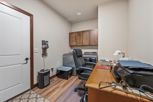 office area with light hardwood / wood-style floors