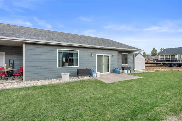 back of house with a yard and a patio area