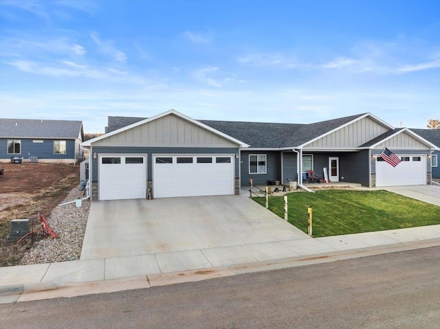 single story home with a front yard and a garage