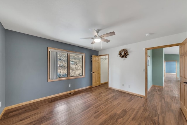 unfurnished bedroom with ceiling fan, a closet, and wood-type flooring