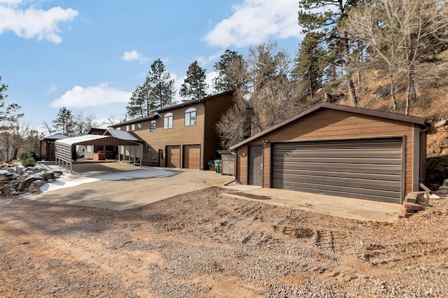 view of front of house featuring a carport and a garage