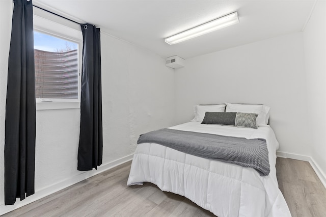 bedroom with light wood-type flooring