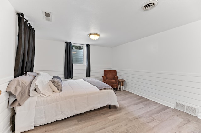 bedroom with light hardwood / wood-style floors