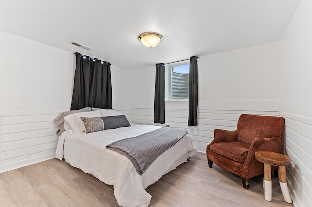 bedroom with light hardwood / wood-style floors