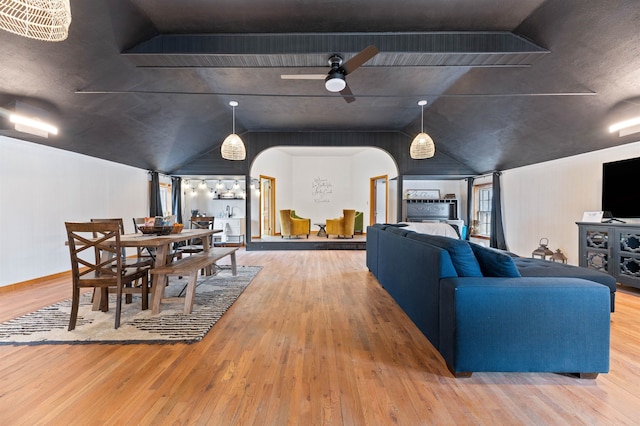 interior space with hardwood / wood-style flooring, ceiling fan, and lofted ceiling