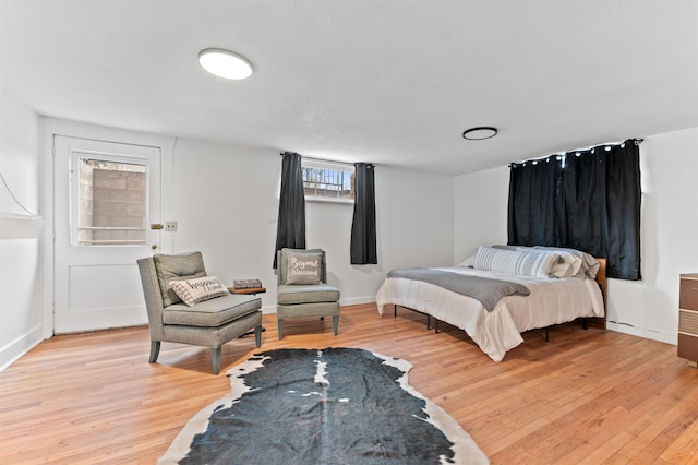 bedroom with light hardwood / wood-style floors