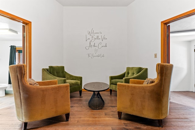 sitting room featuring wood-type flooring