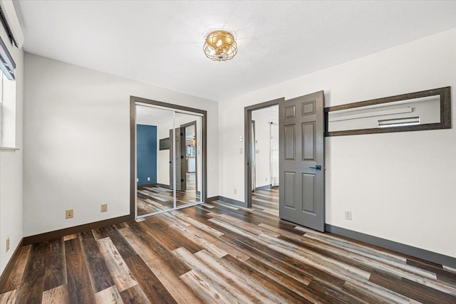 empty room with dark hardwood / wood-style floors