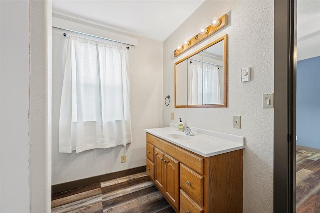 bathroom with wood-type flooring and vanity