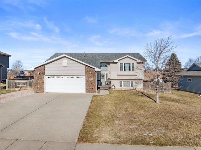 view of front of home featuring a garage and a front lawn