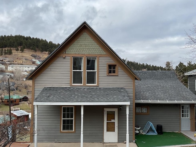 back of house with a patio