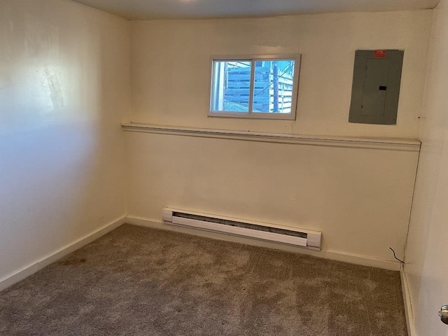 empty room featuring baseboard heating, electric panel, and carpet