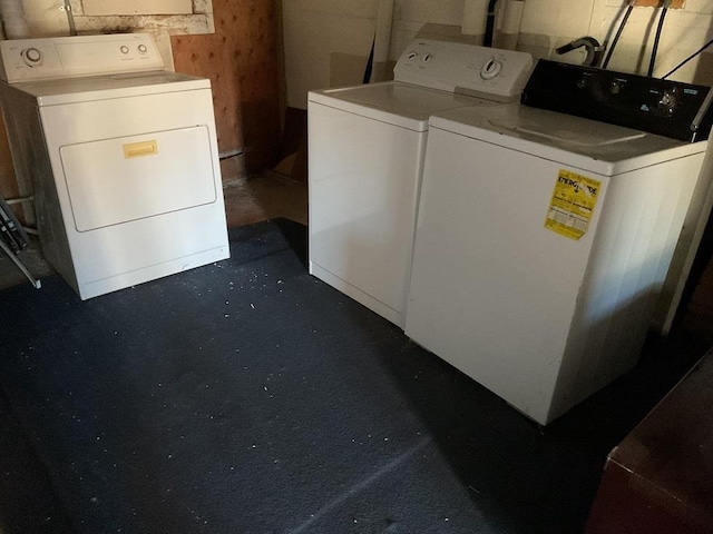 clothes washing area featuring washing machine and clothes dryer