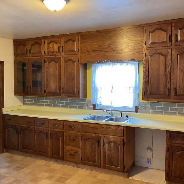 kitchen with tasteful backsplash and sink