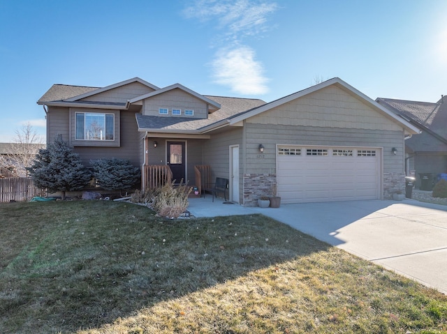 view of front of home featuring a garage and a front lawn