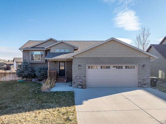 view of front of home featuring a garage and a front lawn