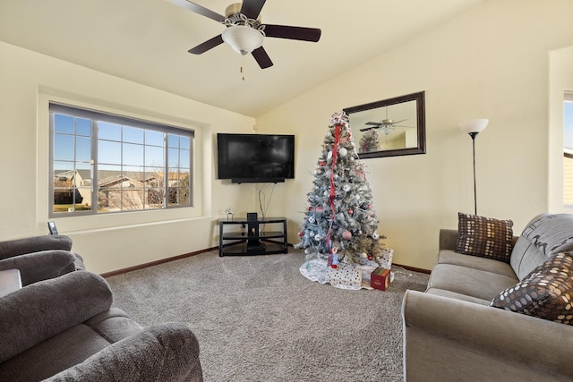 carpeted living room featuring ceiling fan and lofted ceiling