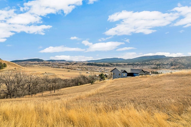 property view of mountains featuring a rural view