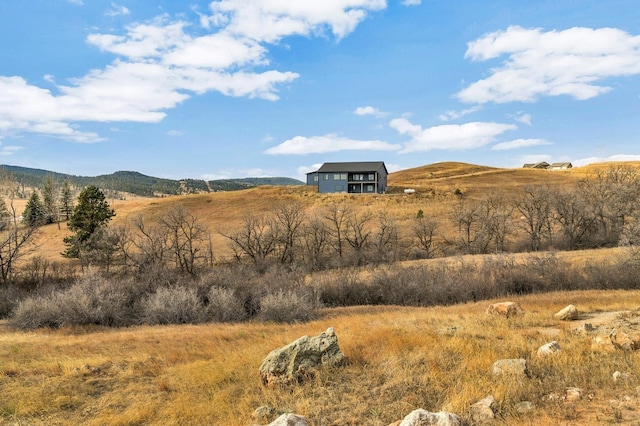 mountain view featuring a rural view