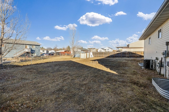 view of yard with central AC