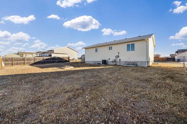 rear view of property with central AC unit