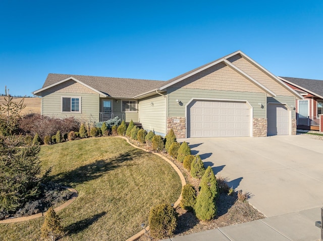 ranch-style home with a front yard and a garage