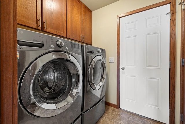 5017 Misty Woods Ln, Rapid City, SD 57701 - washroom featuring separate washer and dryer, light tile patterned flooring, and cabinets