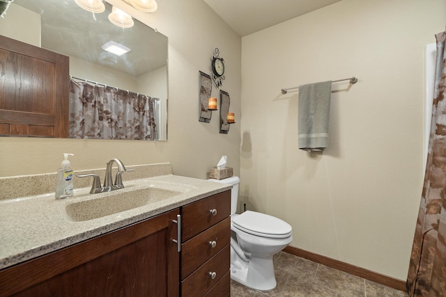 5017 Misty Woods Ln, Rapid City, SD 57701 - bathroom with tile patterned floors, vanity, and toilet