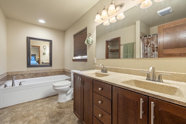 5017 Misty Woods Ln, Rapid City, SD 57701 - bathroom featuring vanity, toilet, and a tub to relax in