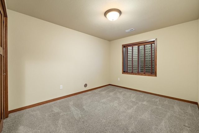 5017 Misty Woods Ln, Rapid City, SD 57701 - carpeted empty room with a textured ceiling