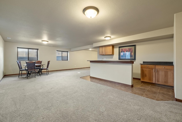 5017 Misty Woods Ln, Rapid City, SD 57701 - kitchen with a textured ceiling and dark carpet