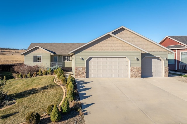 5017 Misty Woods Ln, Rapid City, SD 57701 - view of front of property with a front yard and a garage