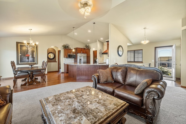 5017 Misty Woods Ln, Rapid City, SD 57701 - living room featuring ceiling fan with notable chandelier, dark hardwood / wood-style floors, and lofted ceiling