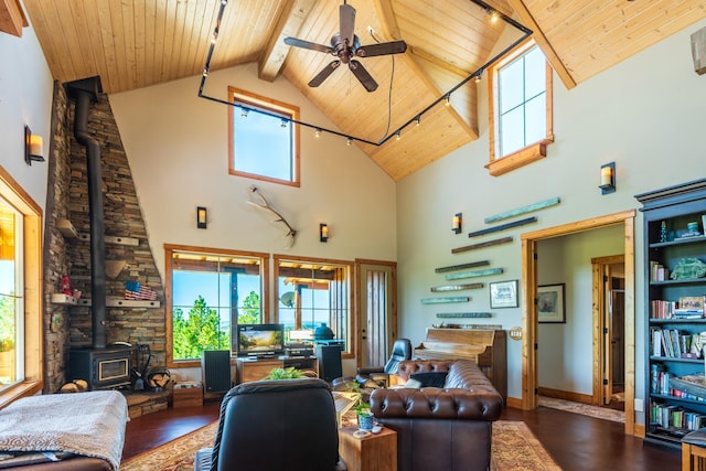 living room featuring dark hardwood / wood-style flooring, high vaulted ceiling, and a wealth of natural light