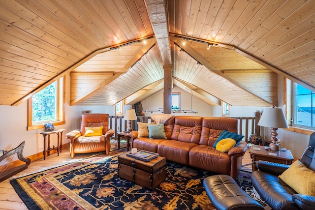 living room with vaulted ceiling with beams, wood ceiling, and hardwood / wood-style flooring