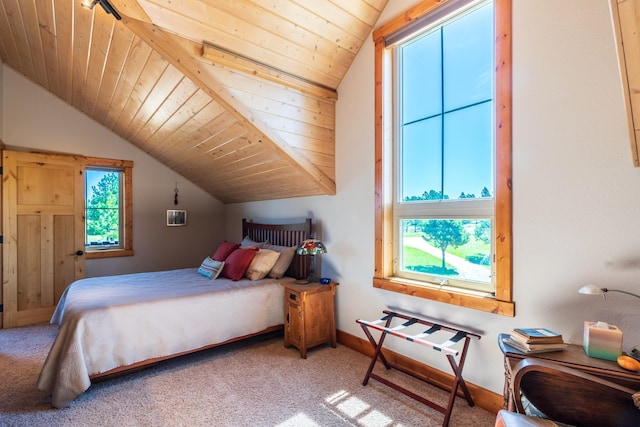 bedroom with carpet, wooden ceiling, and vaulted ceiling