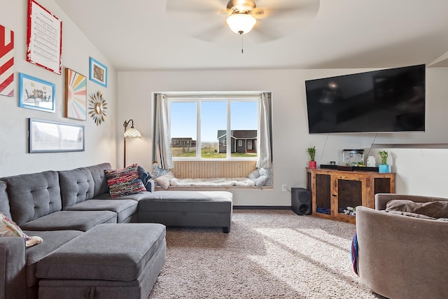 carpeted living room with ceiling fan