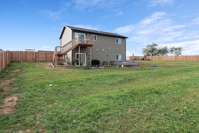 rear view of house with a lawn