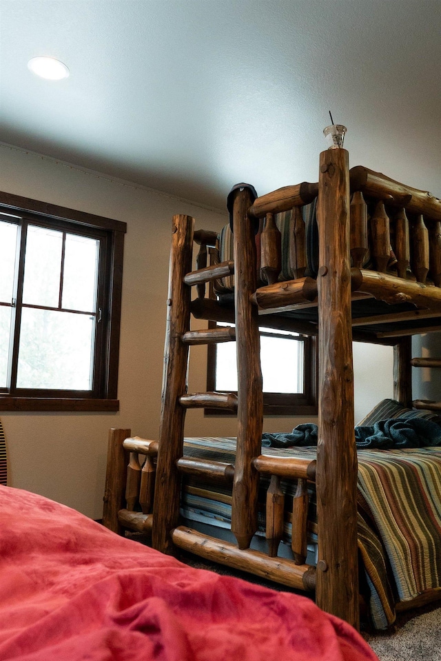 bedroom with multiple windows