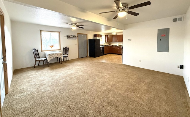 unfurnished living room with electric panel, ceiling fan, and light carpet