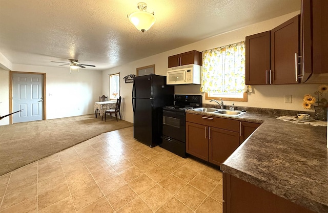 kitchen with black appliances, sink, ceiling fan, a textured ceiling, and light colored carpet