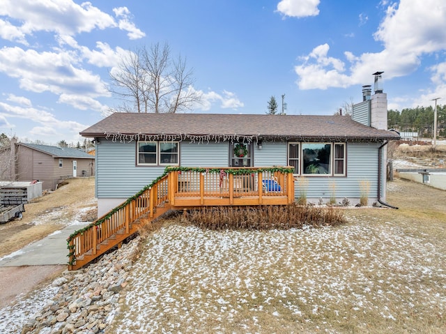 single story home featuring a deck