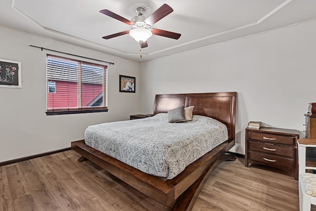 bedroom featuring ceiling fan and light hardwood / wood-style flooring